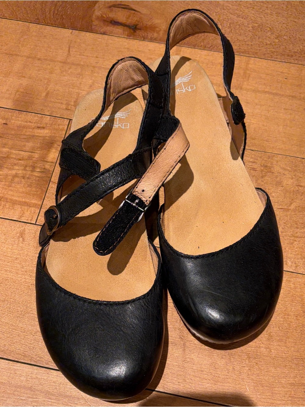 Dansko Black Leather Slingback Mules with Tan Footbed Accent